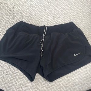 Black Nike running shorts